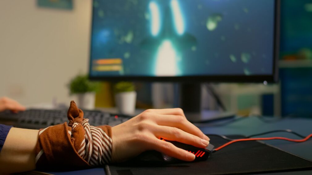 Close up of hand holding a computer mouse